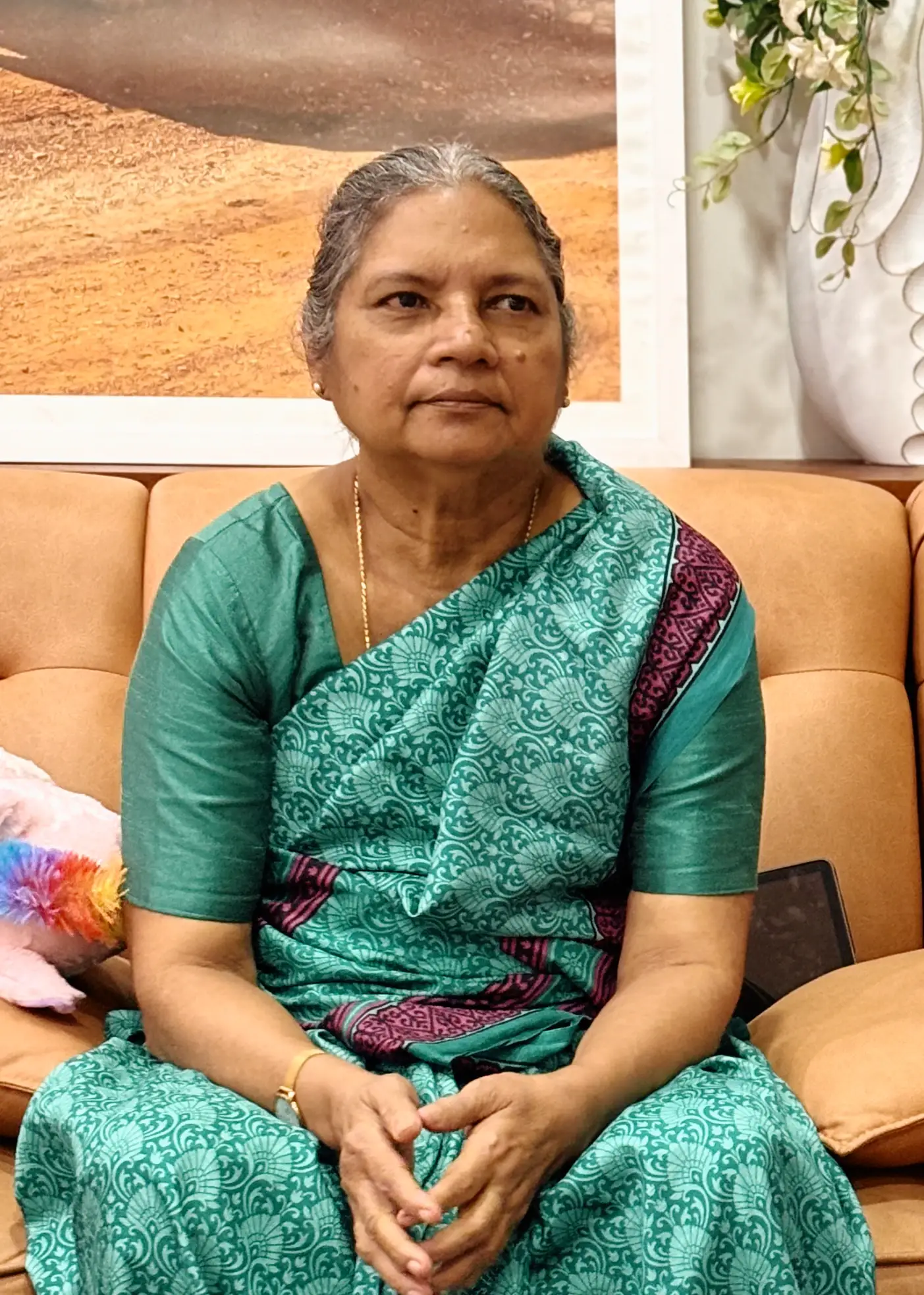 Lilly Joseph, the author of The Language of Chemistry, Playbook®, seated and facing the camera.
